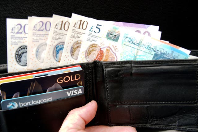 Around 2.1 million Brits are behind on some bills, according to new research (Peter Byrne/PA)