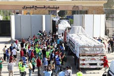 Israel-Gaza war live: Rafah crossing opens for aid trucks as tens of thousands march in London