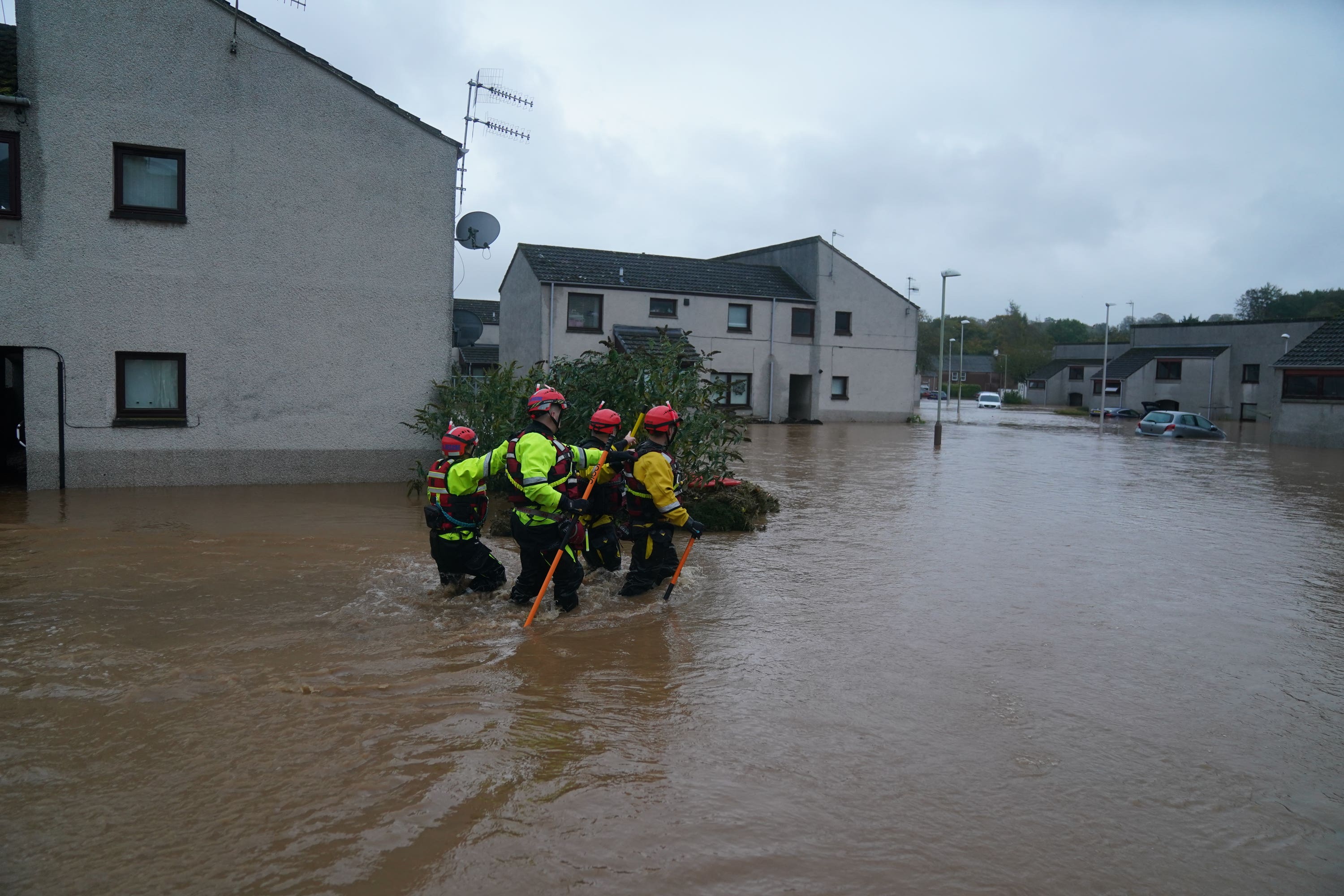 File photo: People are rescued from their flooded homes