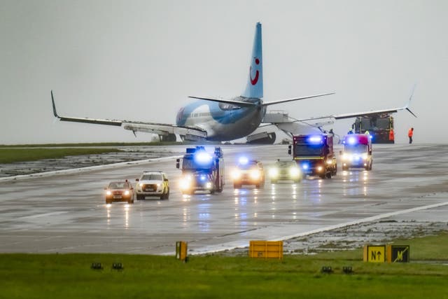 Emergency services attended the scene after a passenger plane came off the runway at Leeds Bradford Airport while landing in windy conditions during Storm Babet (Danny Lawson/PA)