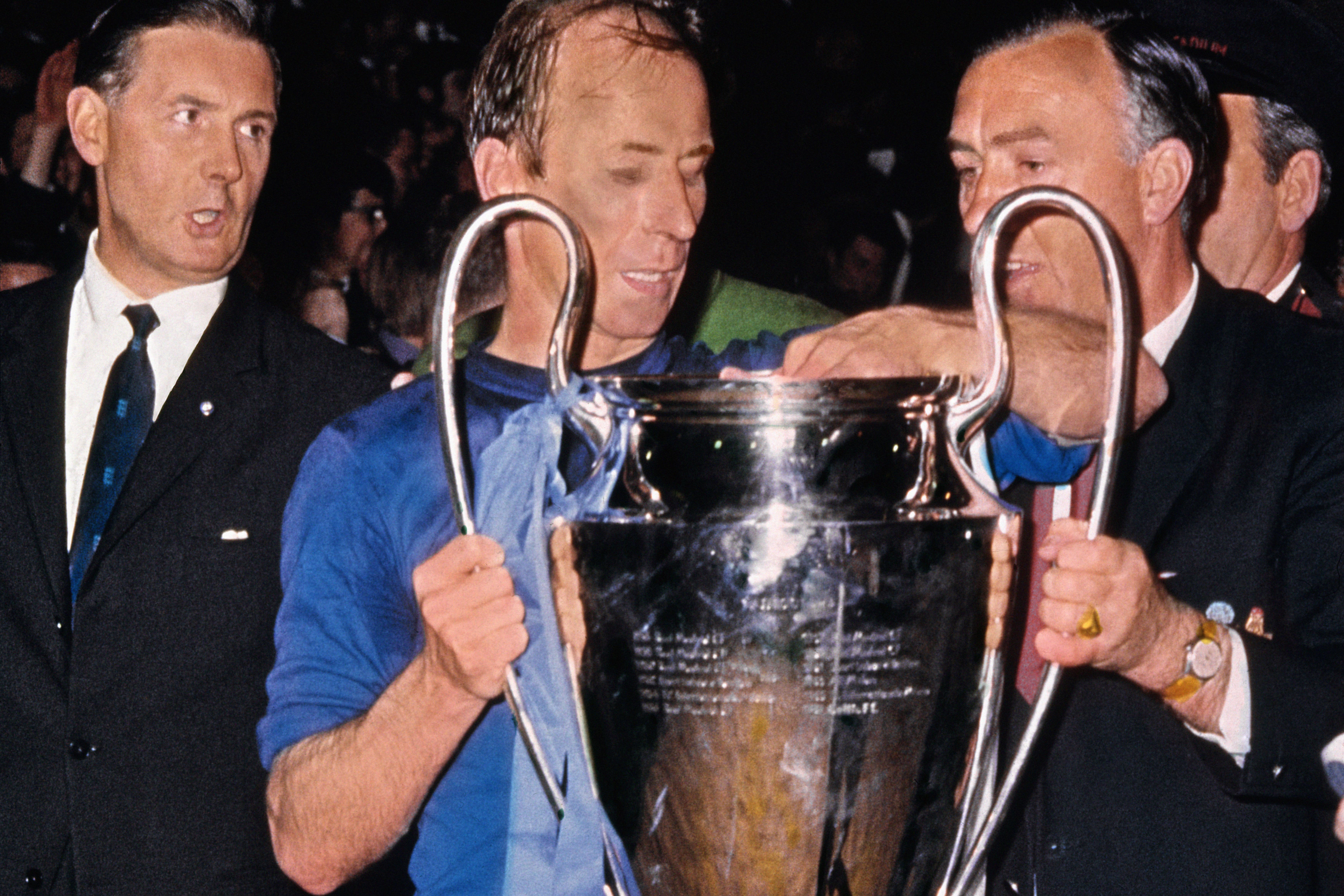 Charlton lifts the European Cup with Manchester United in 1968 (PA)