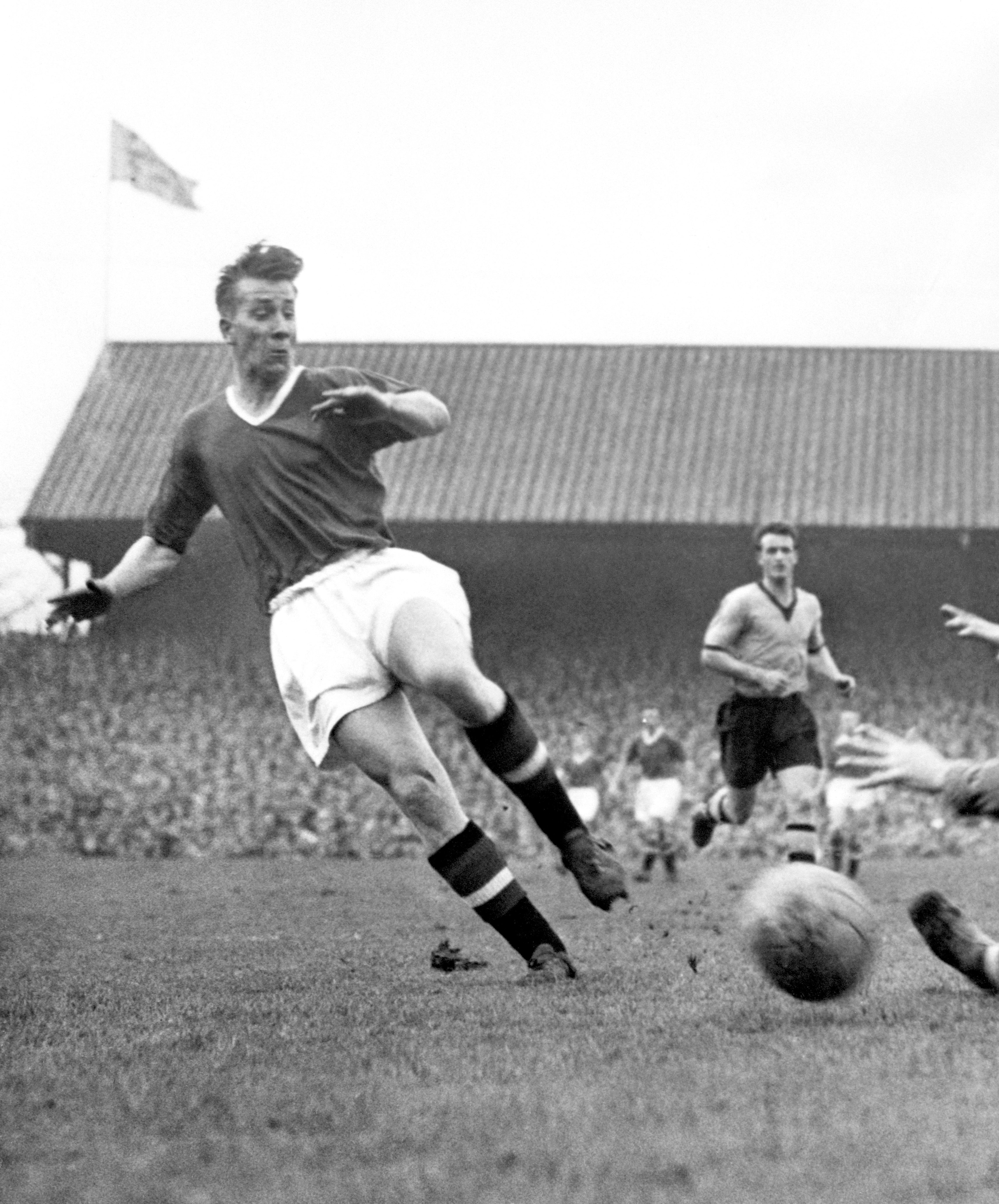 In action as a teenager for Manchester United, March 1957