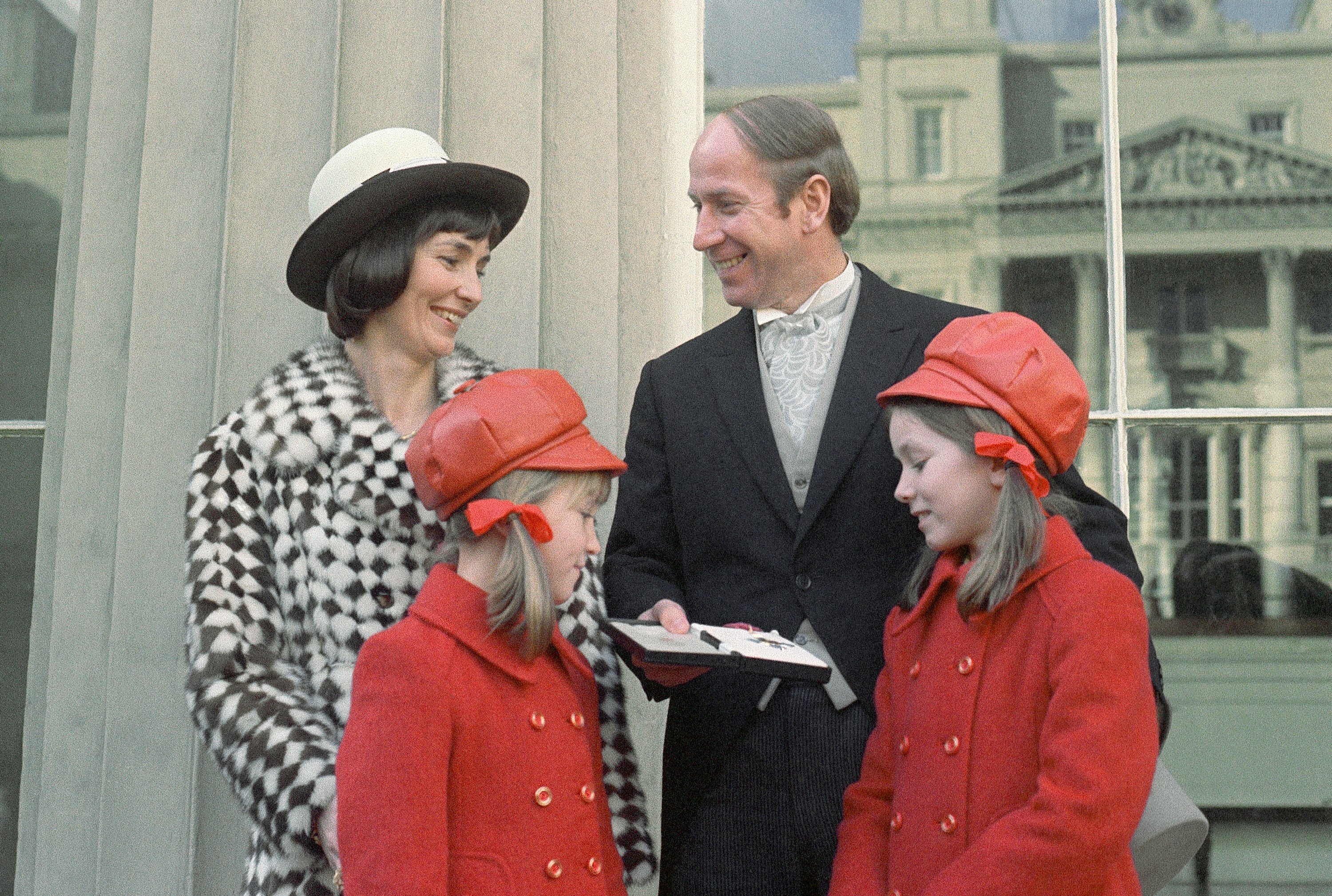 Collecting his CBE at Buckingham Palace in 1974, with his wife Norma and daughters Suzanne and Andrea