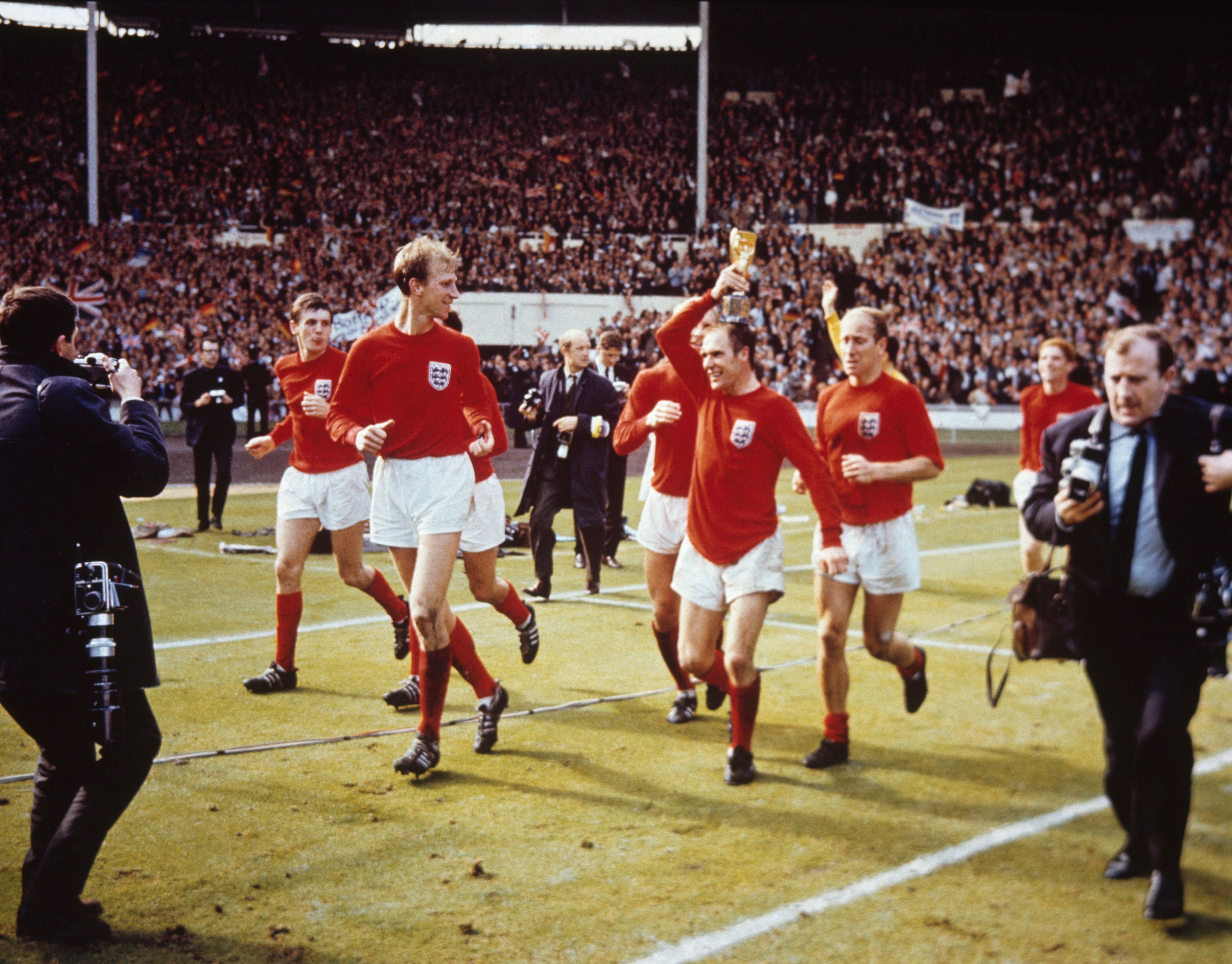 Enjoying a lap of honour as world champions in July 1966
