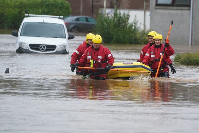 Members of a Coastguard Rescue Team helped residents in Brechin (PA)