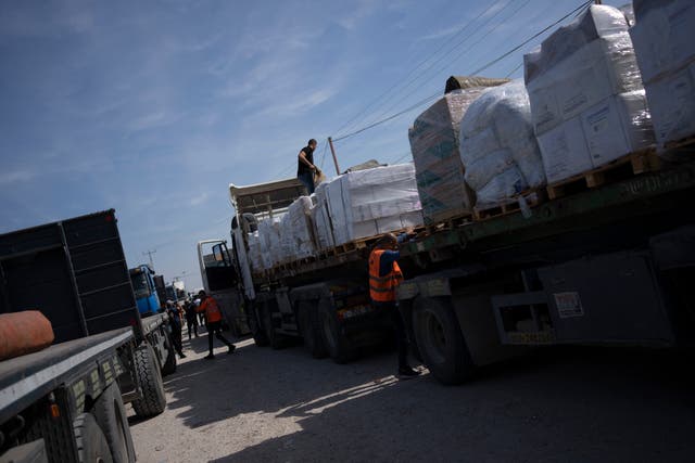<p>Trucks with humanitarian aid for the 'Gaza Strip enter from Egypt in Rafah on Saturday</p>