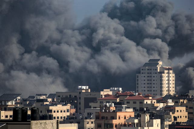 <p>Smoke rises after Israeli air strikes on Gaza City on Sunday </p>