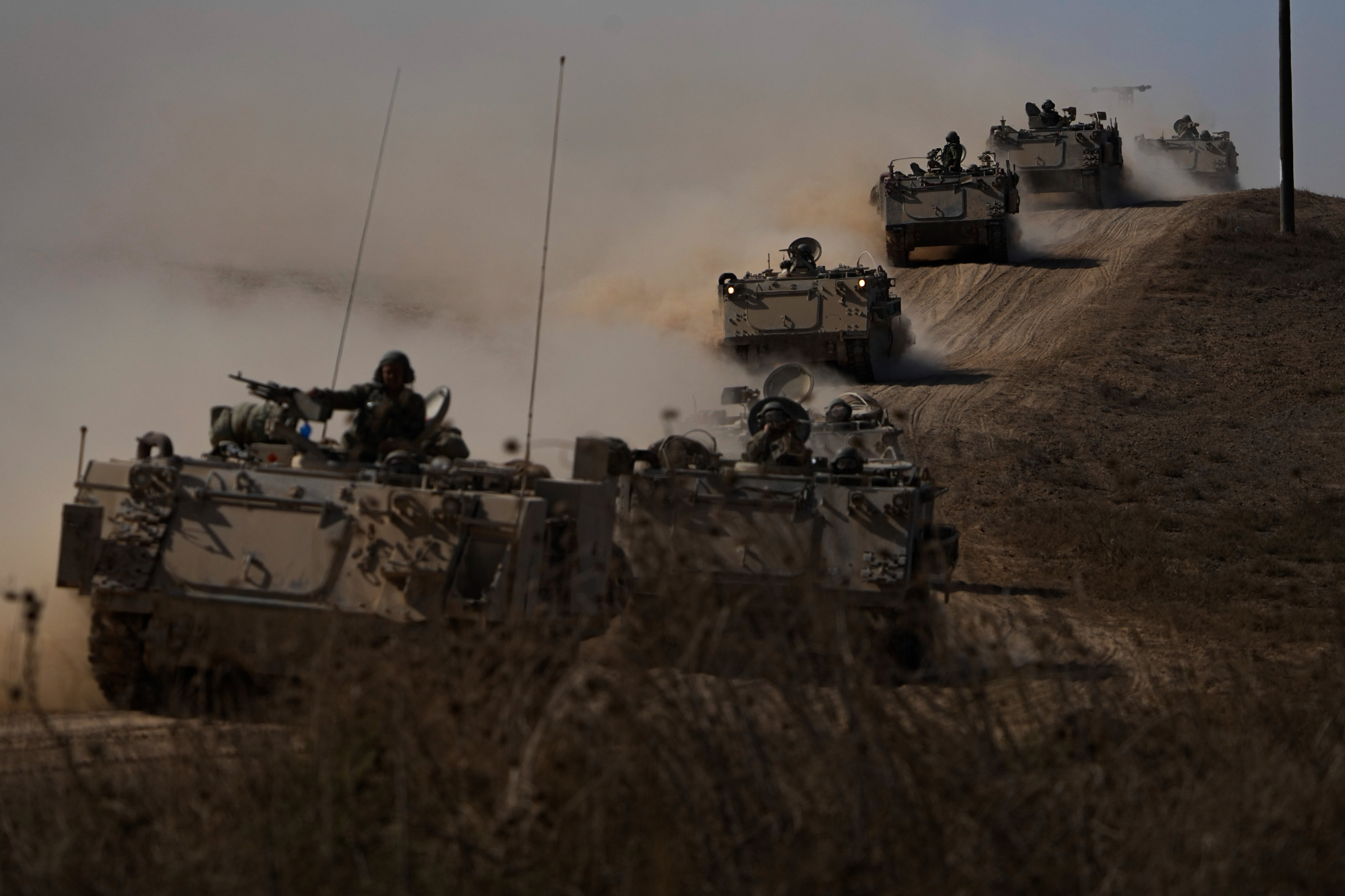 Israeli tanks and armoured vehicles head towards the Gaza Strip border in southern Israel