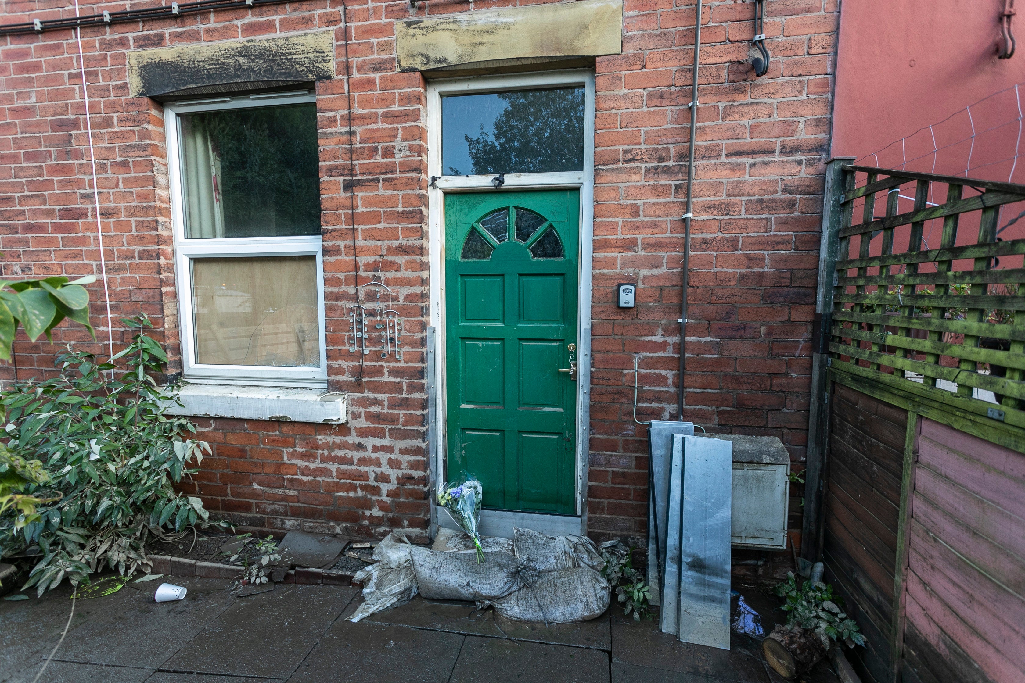 Sandbags at the door of the home of Maureen Gilbert in Chesterfield, Derbyshire