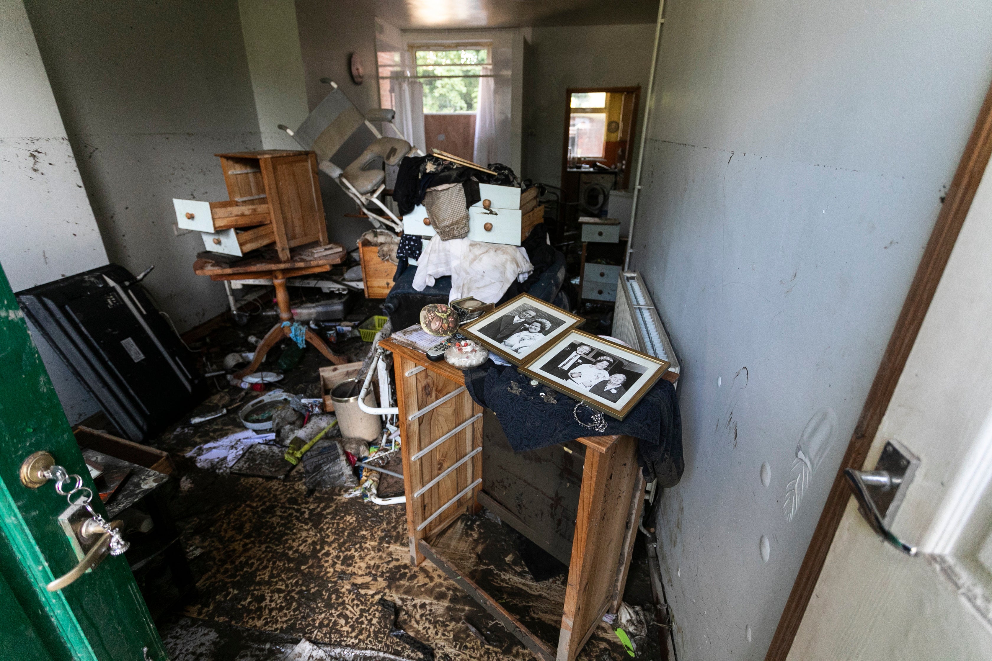 Flood high tide marks are seen over 5ft high in the front room of Maureen Gilbert in Chesterfield