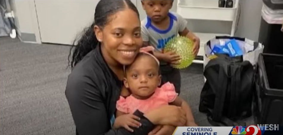 <p>Catorreia Hutto, 31, with her five-year-old twins Ahmed and Ava Jackson</p>