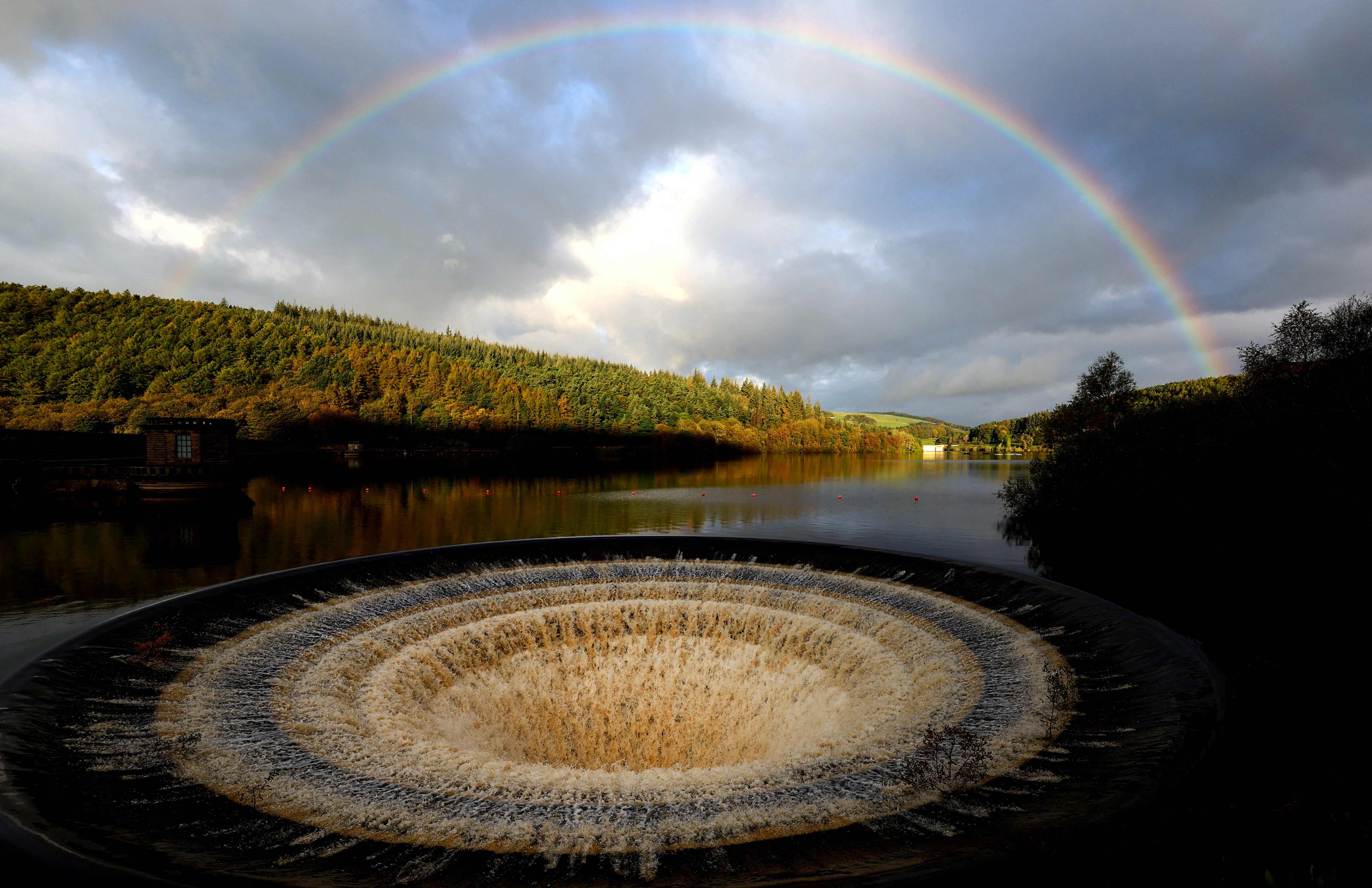 A Ladybower reservoir plug hole is seen after heavy rain from Storm Babet, Castleton, Britain