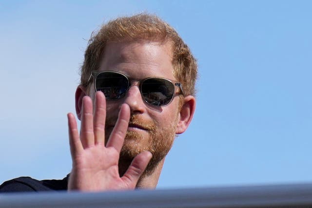 The Duke of Sussex, waves during the Formula One US Grand Prix (Nick Didlick/AP)