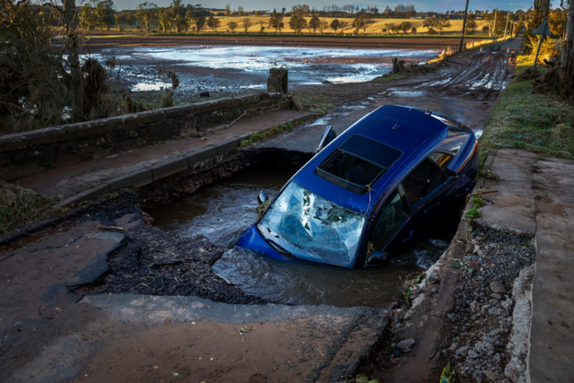 <p>A car is seen in on bridge washed away following yesterdays torrential rain on October 21, 2023 in Dundee, Scotland</p>