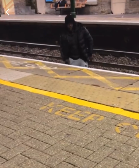 The man jumped over the tracks to harass a woman on the opposite platform