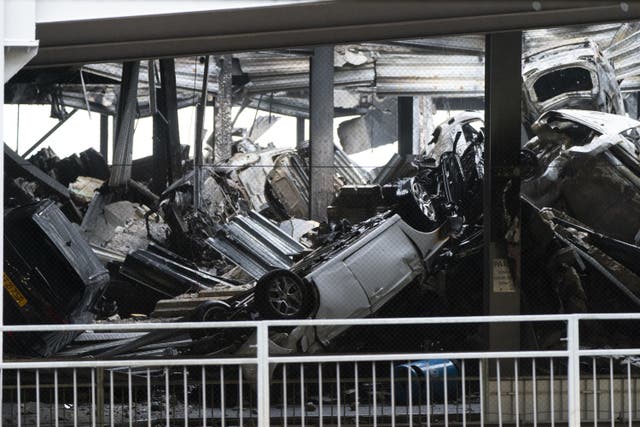 Bedfordshire Police arrested a man in connection with a massive fire that caused Luton Airport’s Terminal Car Park 2 to collapse (Jordan Pettitt/PA)