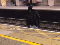 Police investigation after video of man crossing rail tracks to harass woman goes viral
