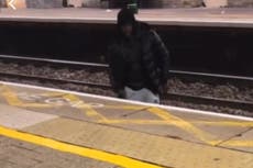 Police investigation after video of man crossing rail tracks to harass woman goes viral