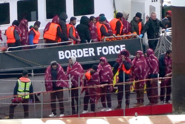 A group of people thought to be migrants are brought into Dover, Kent, following a small boat incident in the Channel (Gareth Fuller/PA)