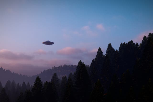 <p>3D illustration of a UFO over a mountain </p>