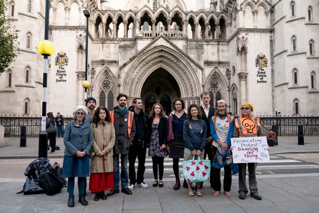 Just Stop Oil protesters at the Royal Courts of Justice in London, where they are accused of breaching a civil court order aimed at restricting protest on the M25 (Aaron Chown/PA)