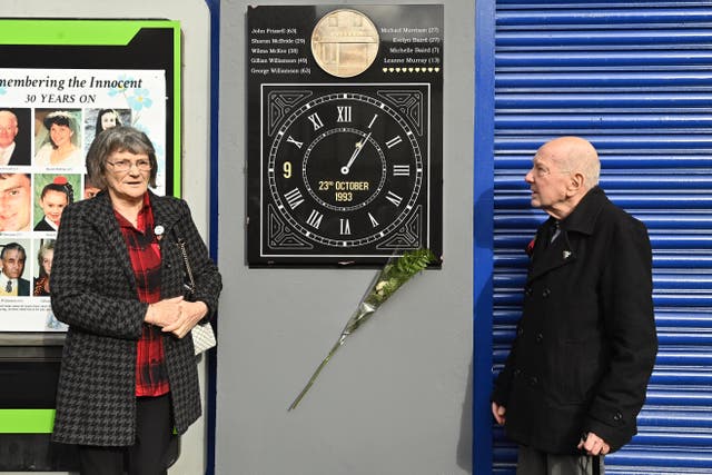Gina Murray and Robert Baird, who had family members killed in the Shankill Road blast, during the unveiling and dedication (Oliver McVeigh/PA)