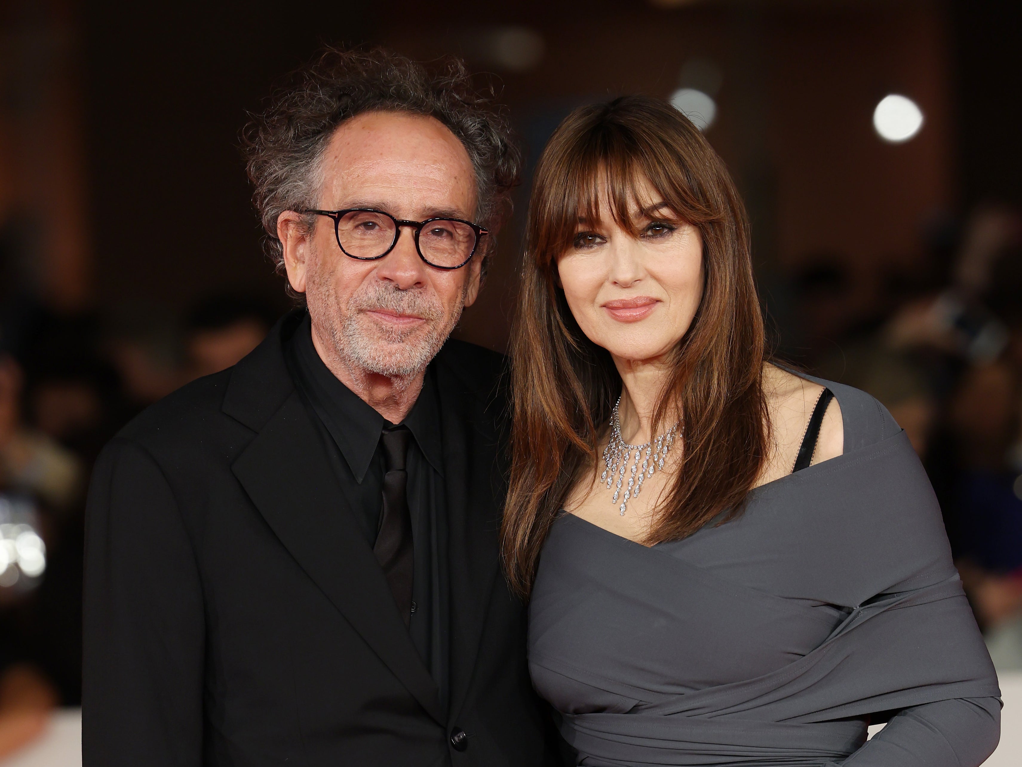 Tim Burton looks so in love with Monica Bellucci as they make