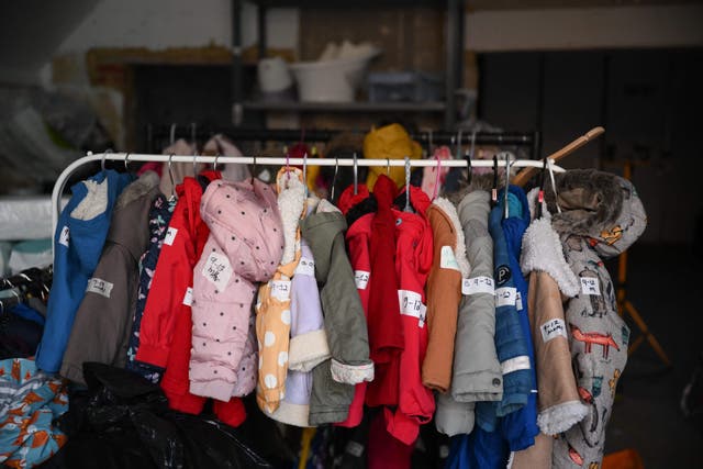 <p>Donated children’s jackets are pictured at the Hackney Children & Baby Bank centre ready to be distributed to support families with young children, in Hackney, east London </p>