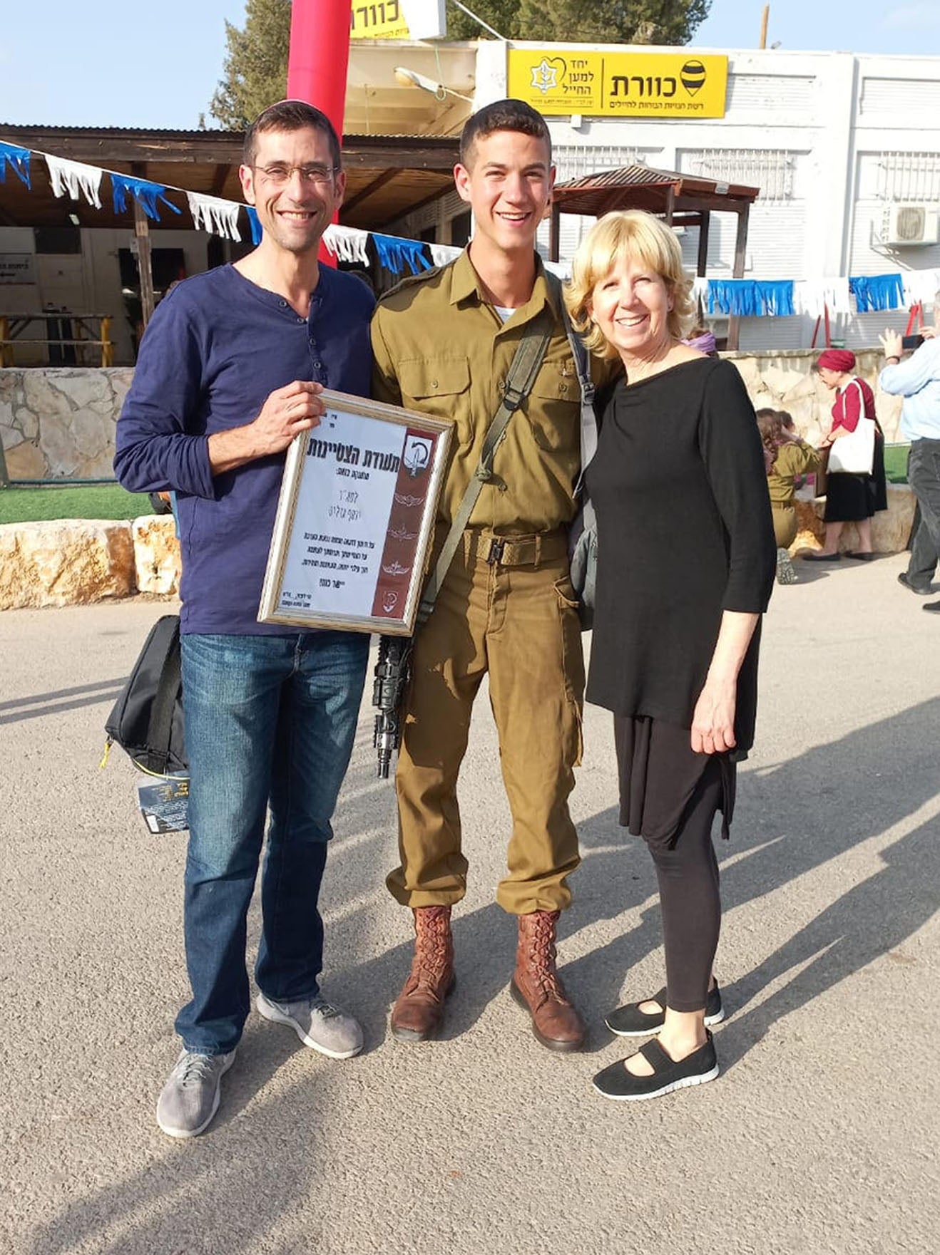 Yosef with his parents, David and Dina