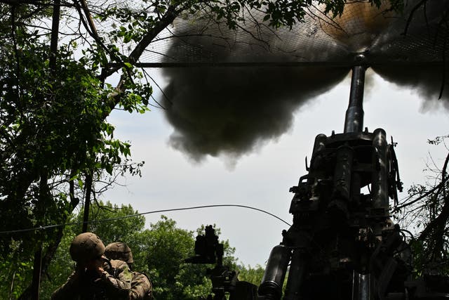 <p>Ukrainian artillerymen fire an M777 howitzer towards Russian positions near Avdiivka</p>