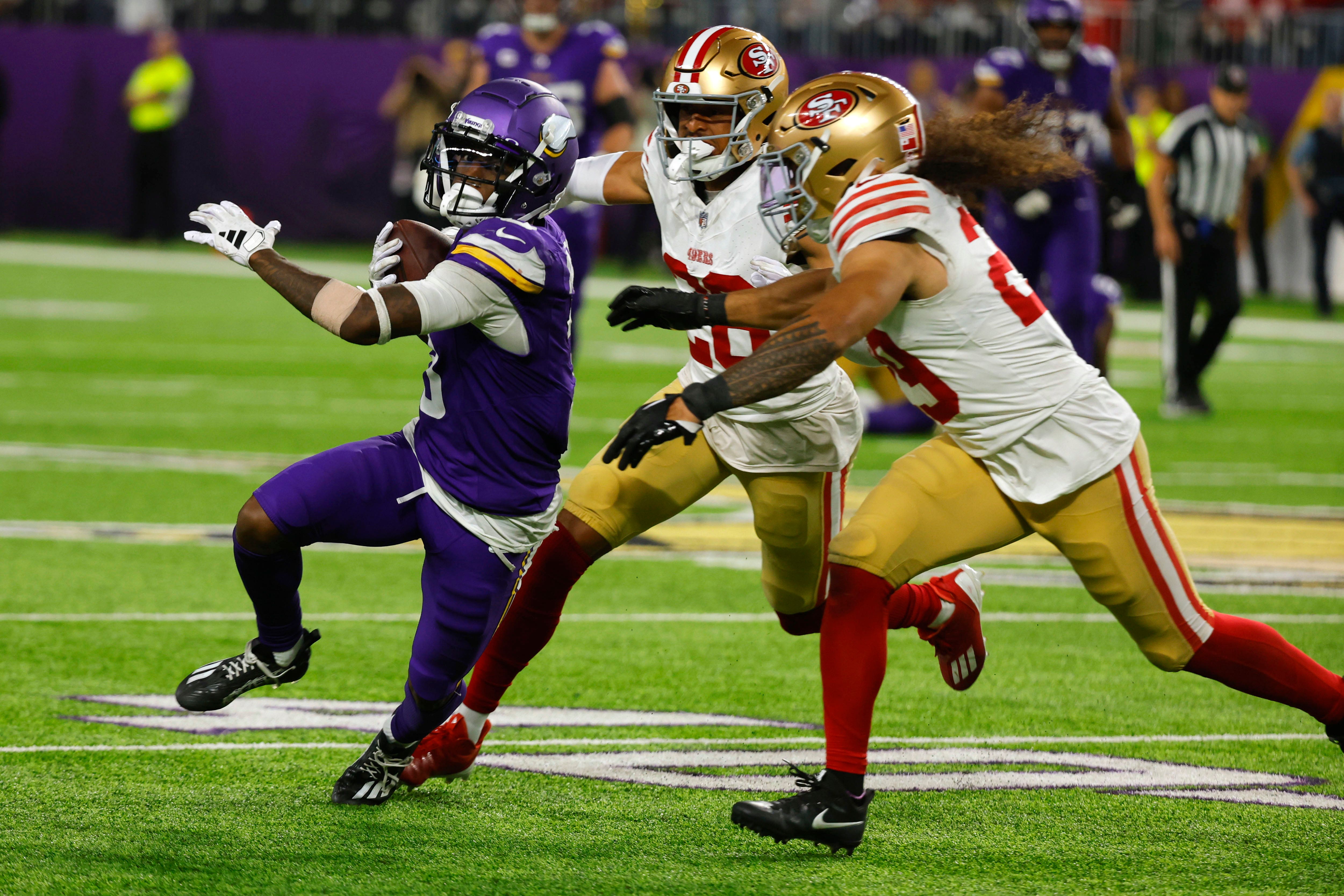 Minnesota Vikings wide receiver Jordan Addison (3) runs from San Francisco 49ers safety Talanoa Hufanga (Bruce Kluckhohn/AP)