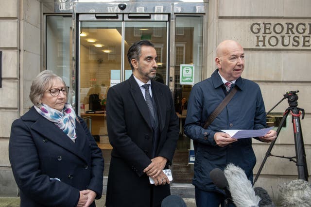 Alan Inglis (right) reads a statement outside the Scottish Covid-19 Inquiry (Lesley Martin/PA)