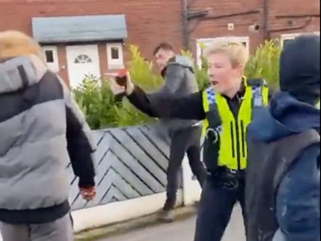 <p>West Yorkshire Police officer was filmed deploying irritant spray on members of the public in Rothwell, Leeds </p>