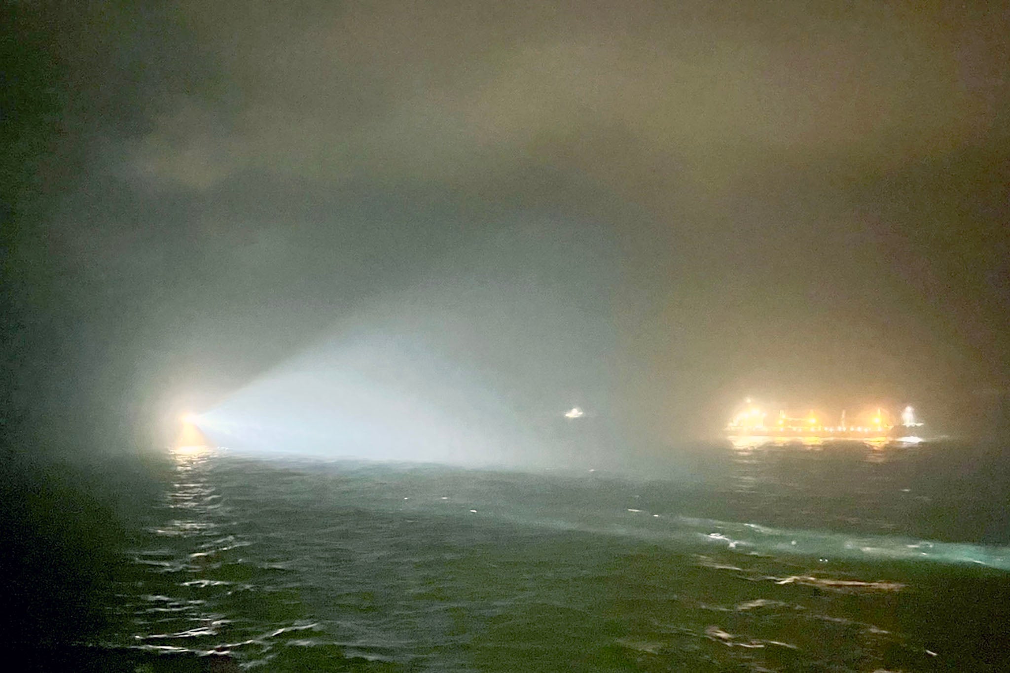 Handout photo showing search lights scanning the water near to where the British cargo ship Verity sank following a collision with the Bahamas-flagged vessel Polesie in the North Sea