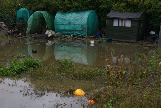 Debris and floodwater in allotments in Retford, Nottinghamshire (Jacob King/PA)
