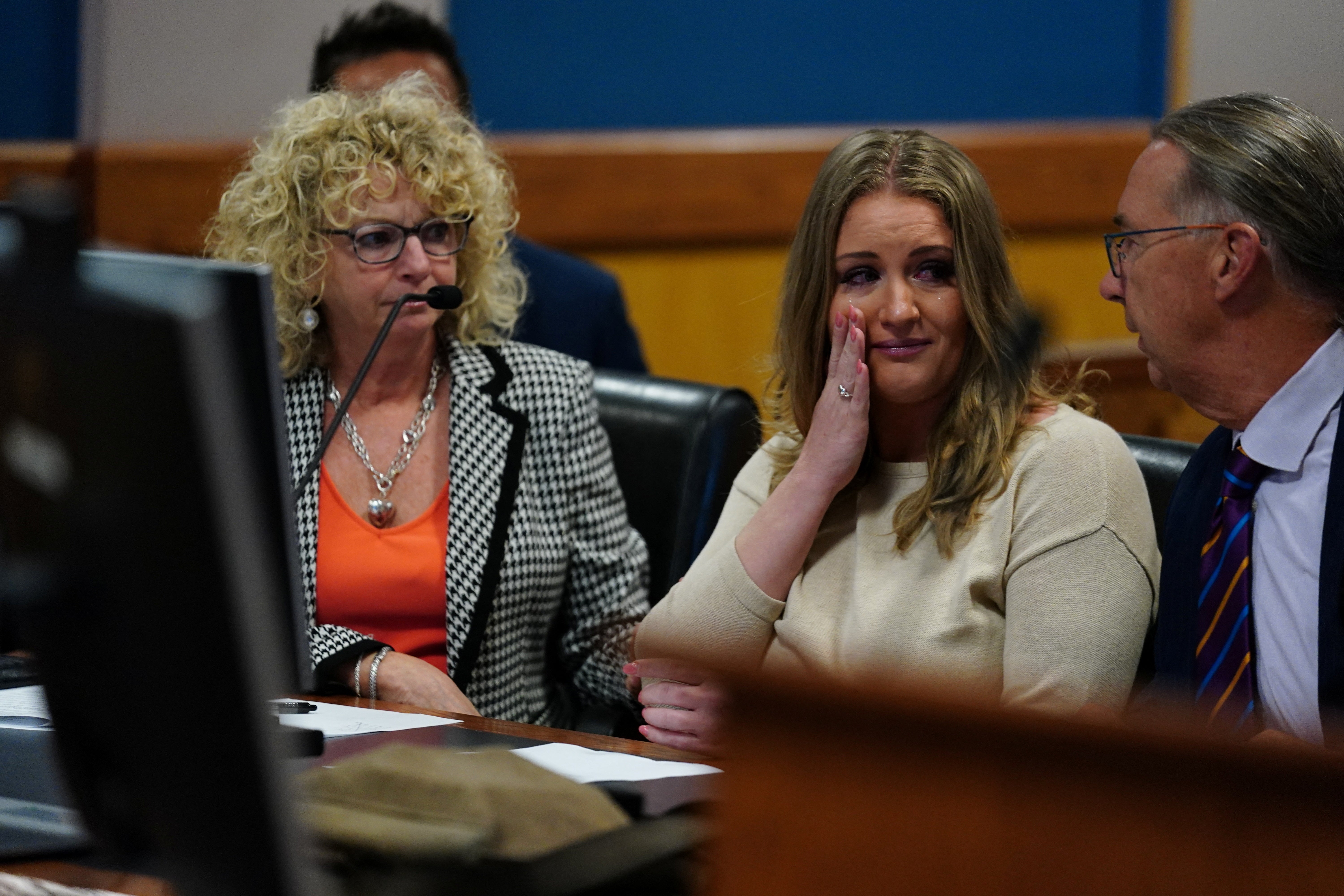 Jenna Ellis reacts after pleading guilty to a felony count of aiding and abetting false statements and writings, inside Fulton Superior Court Judge Scott McAfee’s courtroom on 24 October 2023