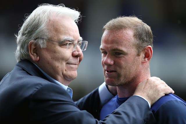 <p>Bill Kenwright embracing Everton’s Wayne Rooney</p>
