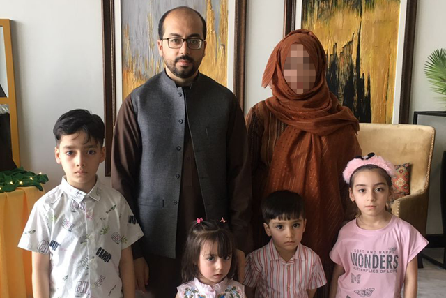 <p>Mohammad Zaker Nasery with his wife and four children, who are aged nine, six, five and three </p>