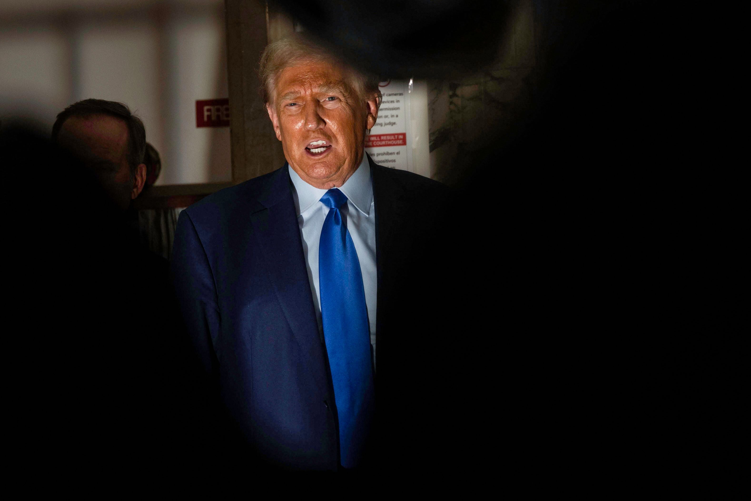 Donald Trump talks to reporters outside Judge Arthur Engoron’s courtroom in New York Supreme Court on 24 October.