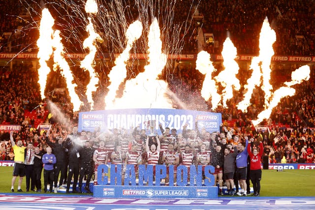 Wigan Warriors lift the trophy after winning the Betfred Super League (Richard Sellers/PA)