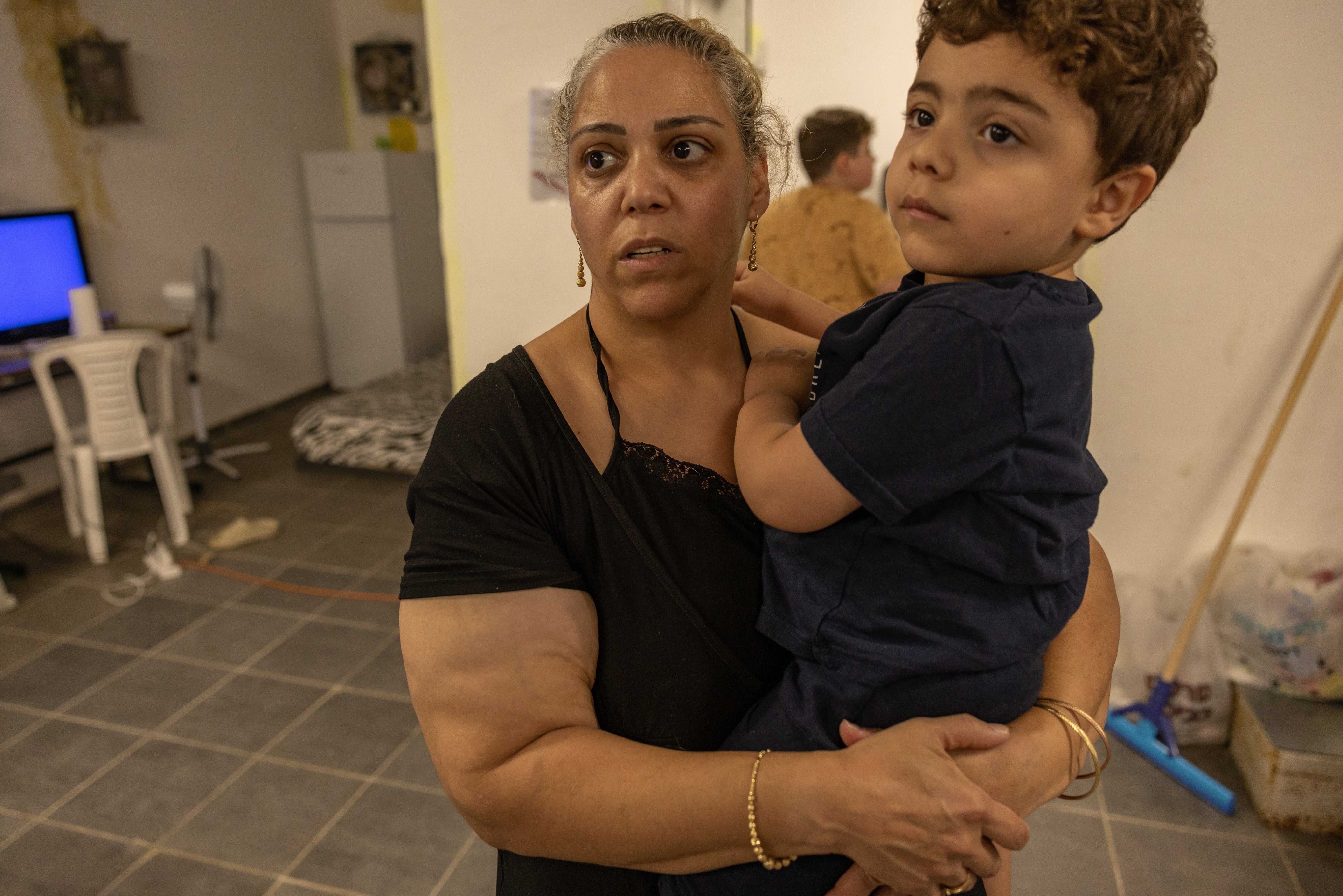 Mother-of-three Efrat Peretz, 43, with her son