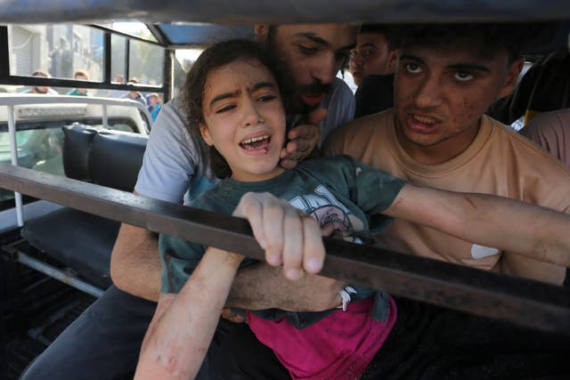 Palestinians rescue survivors of an Israeli air strike on the Gaza Strip in Rafah (AP Photo/Hatem Ali)