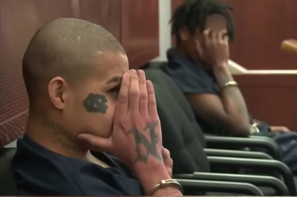 Teenagers accused of killing ex-police chief seen laughing at his family in court