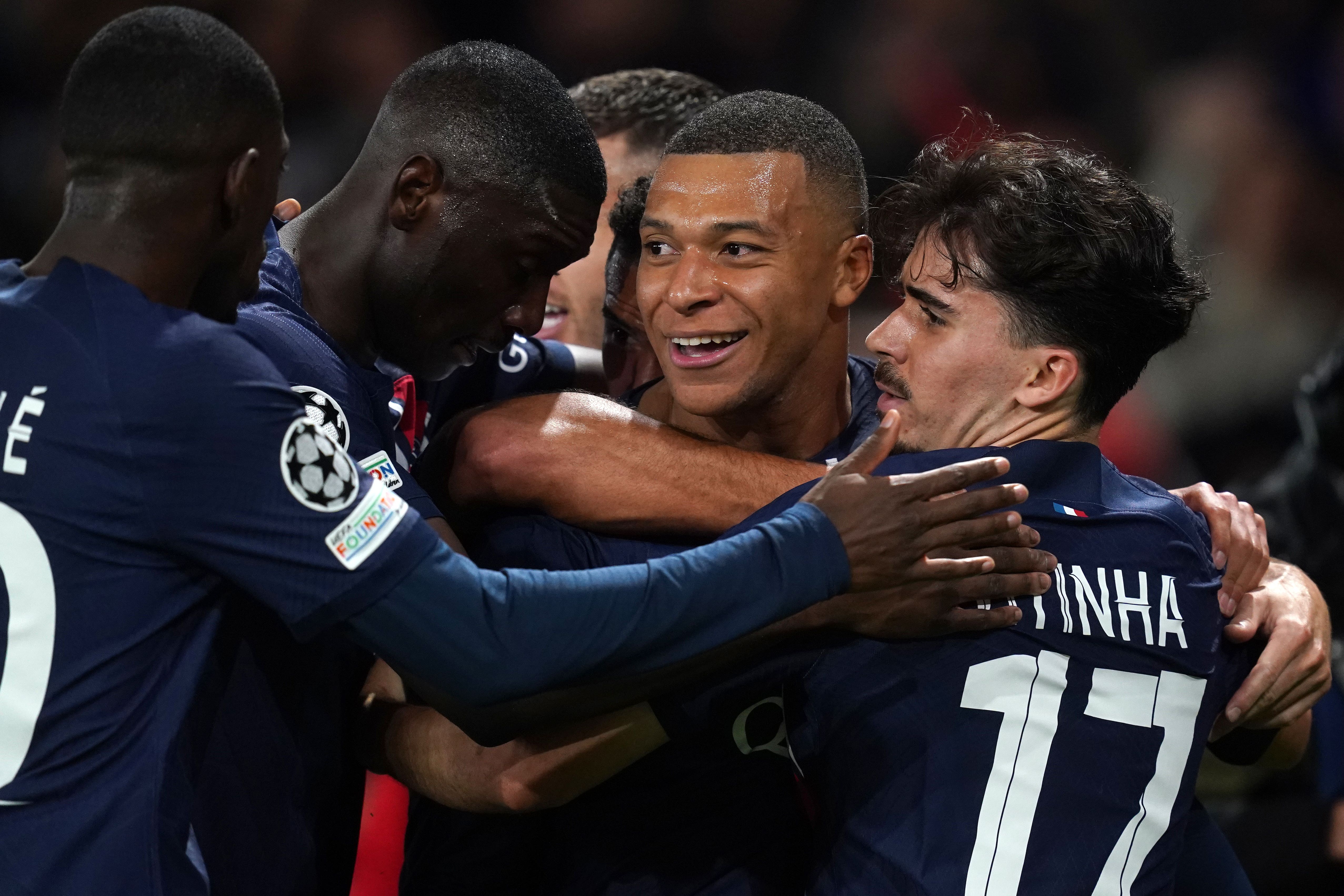 Kylian Mbappe (centre) was on the scoresheet as Paris St Germain claimed a 3-0 win over AC Milan (David Davies/PA)