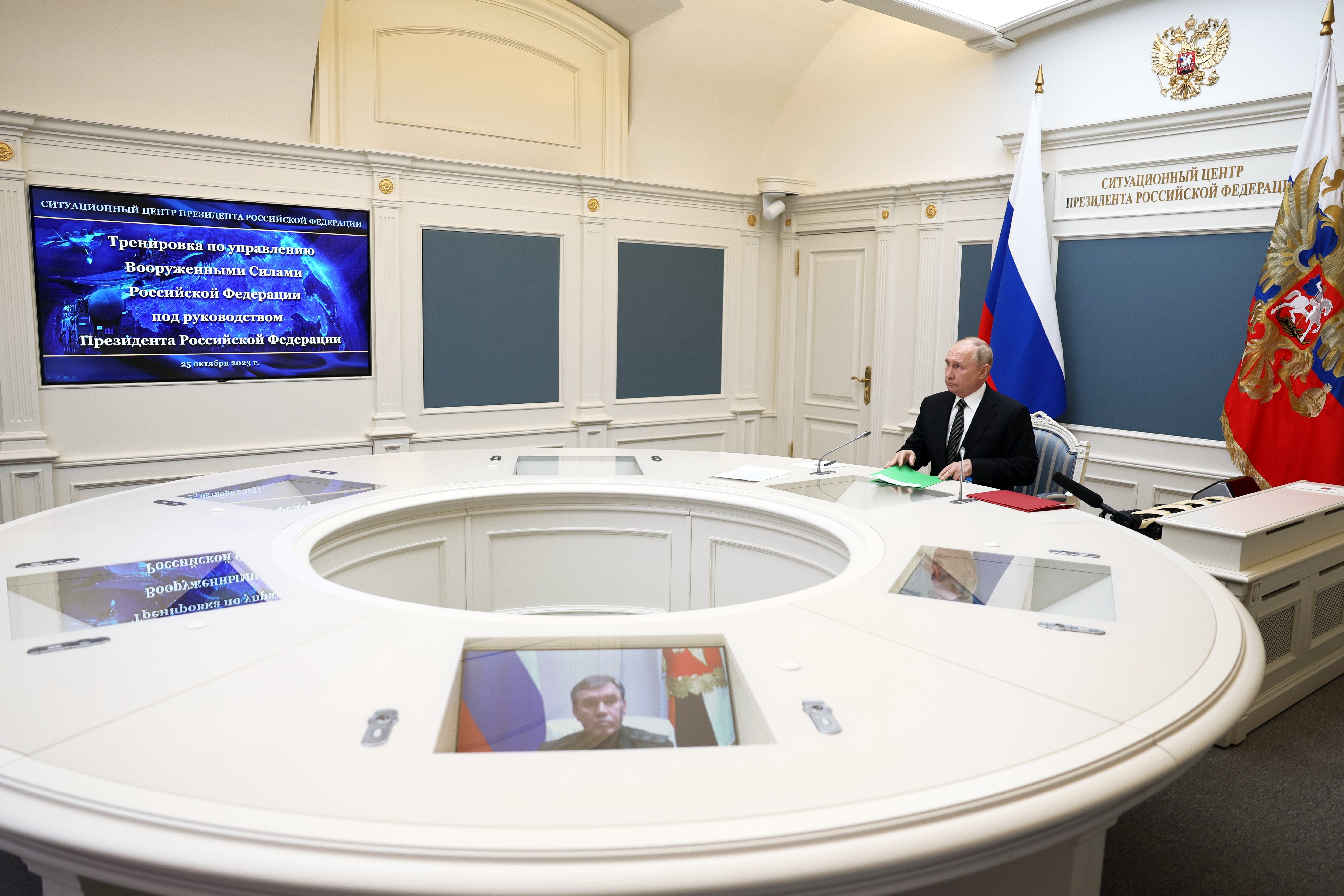 Russian president Vladimir Putin attends a training to test the strategic deterrence forces via a video link in Moscow