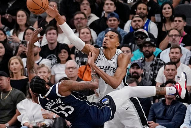 Dallas Mavericks forward Derrick Jones Jr (55) has his shot blocked by San Antonio Spurs centre Victor Wembanyama (Eric Gay/AP)