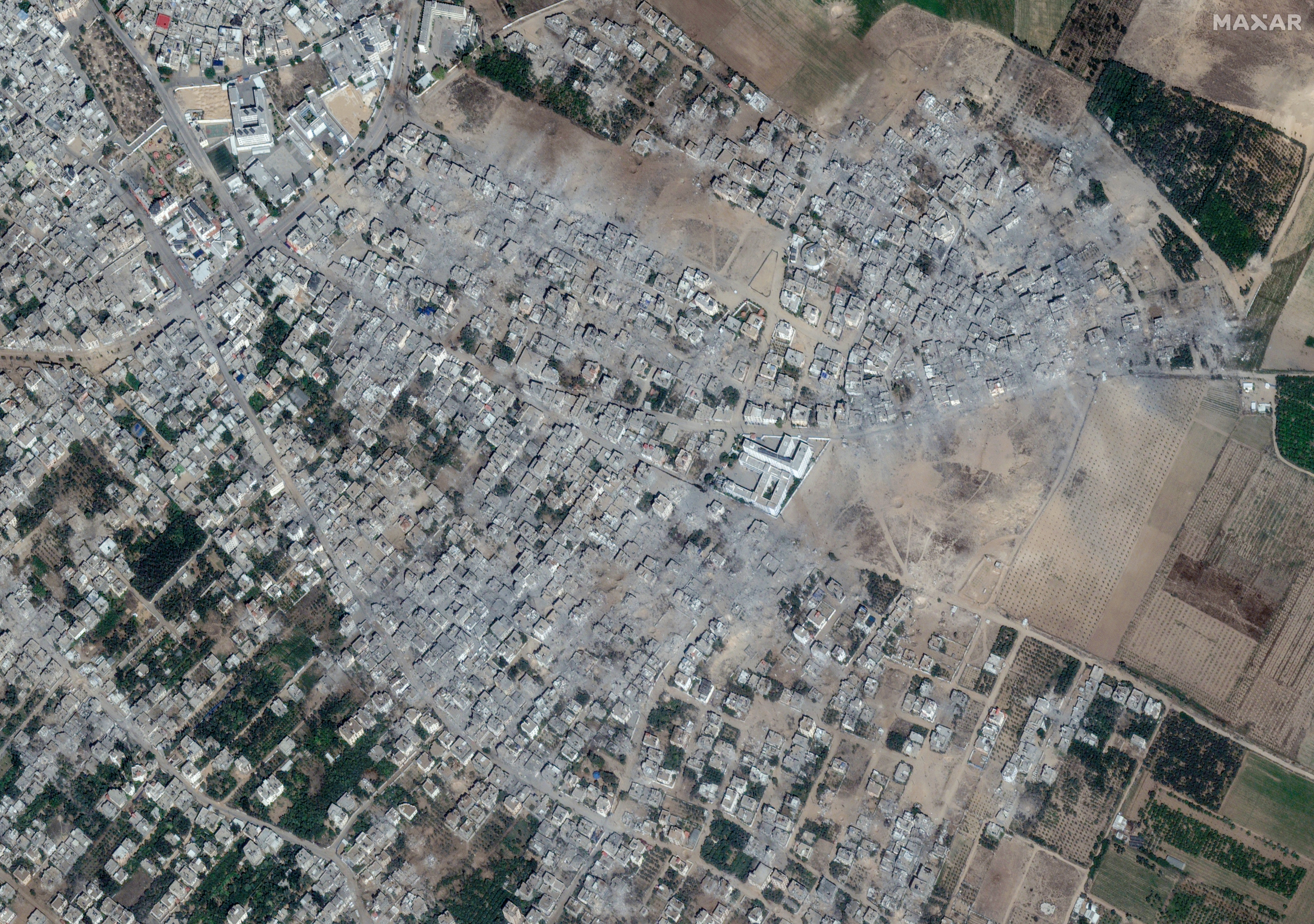 Satellite view shows damaged areas in the Palestinian city of Beit Hanoun in the northern Gaza Strip on 21 October, mostly reduced to charred remains and piles of grey ash