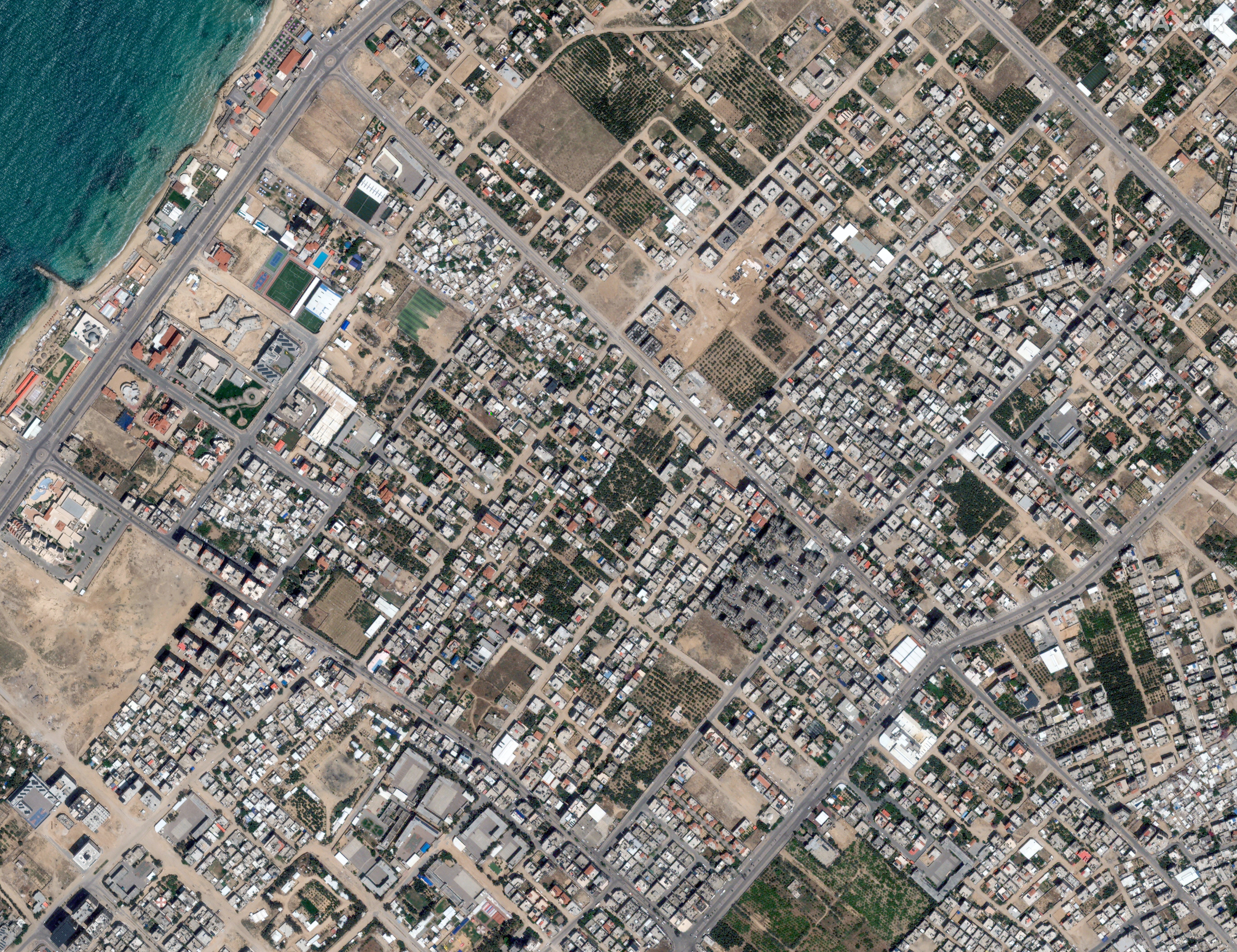 Satellite view shows Al-Karama in the Gaza Strip on 10 May, offering a striking contrast to those taken in recent days