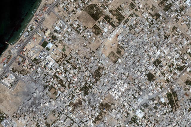 <p>Satellite view shows damaged areas in Al-Karama in the Gaza Strip on 21 October amid the ongoing conflict between Israel and Hamas</p>
