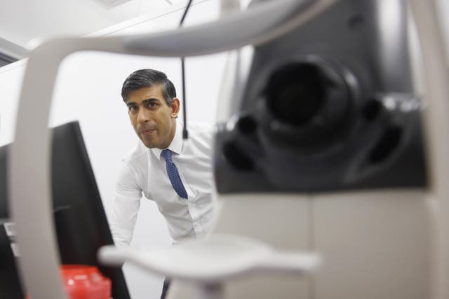 Prime Minister Rishi Sunak is shown a retinal scan procedure during a visit to Moorfields Eye Hospital in London (Jaime Lorriman/The Daily Telegraph/PA)